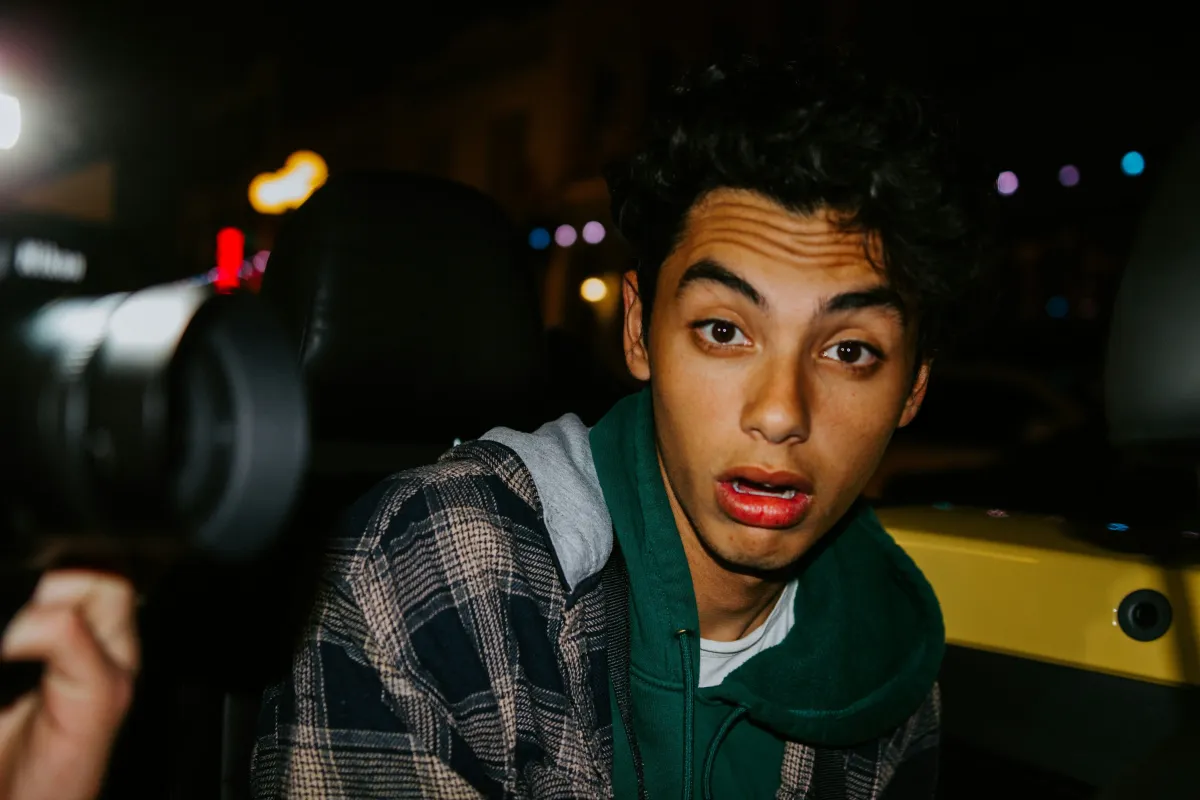 A person showing genuine emotion while speaking to camera